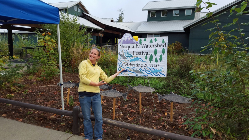Morgan Greene welcomes guests to the 26th annual Nisqually Watershed Festival